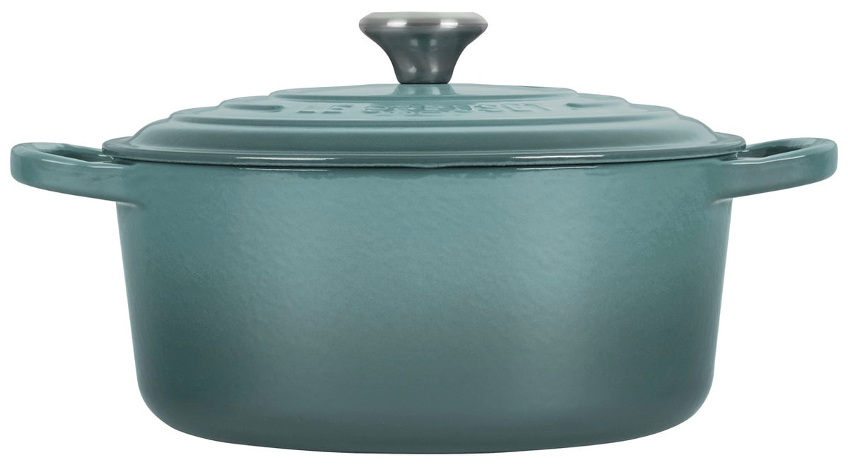Front view of Signature Round Dutch Oven in Sea Salt showcasing its covered design and wide loop handles with a white background