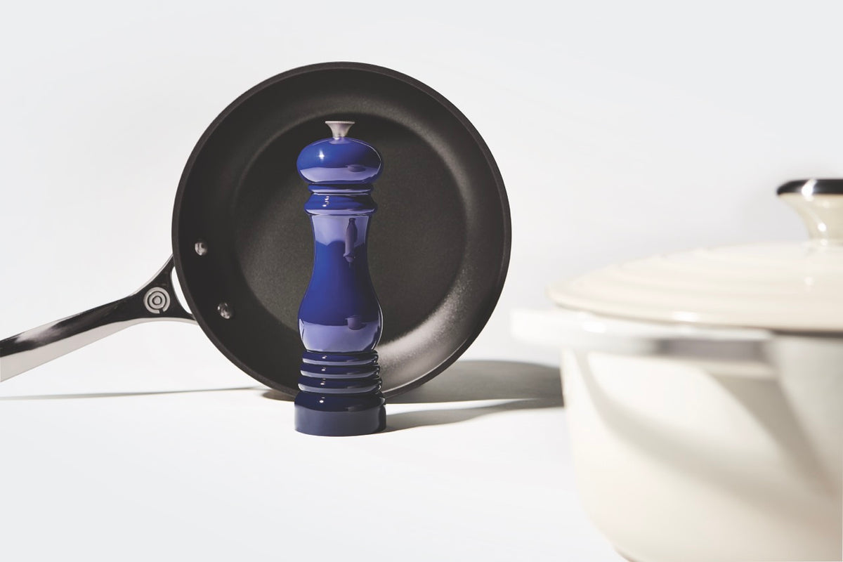 Front view of stainless steel nonstick frying pan showing black nonstick interior and stainless handle