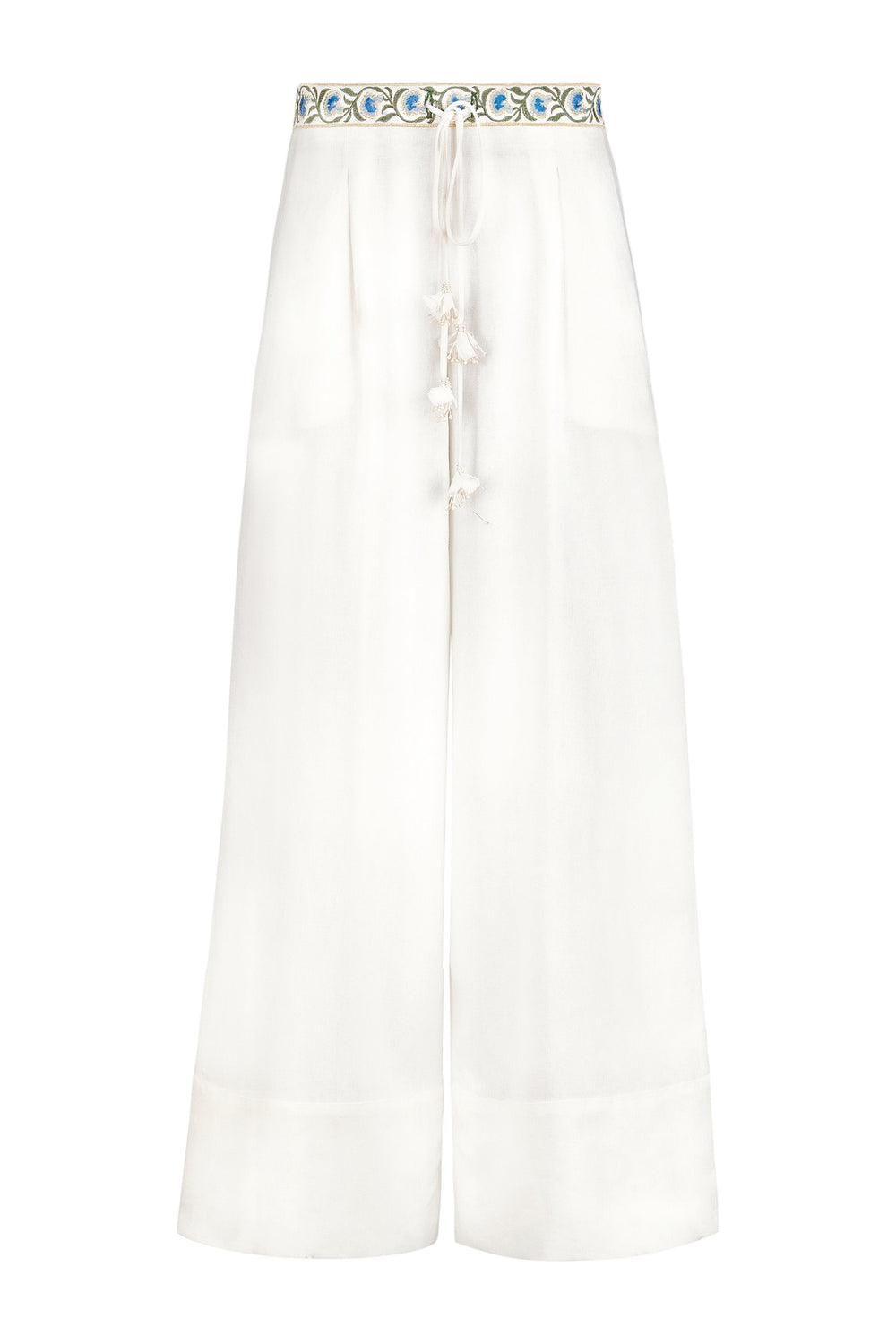 Front view of Carnation Pants showing embroidered blue floral waistband and tasseled drawstring on off-white wide-leg pants