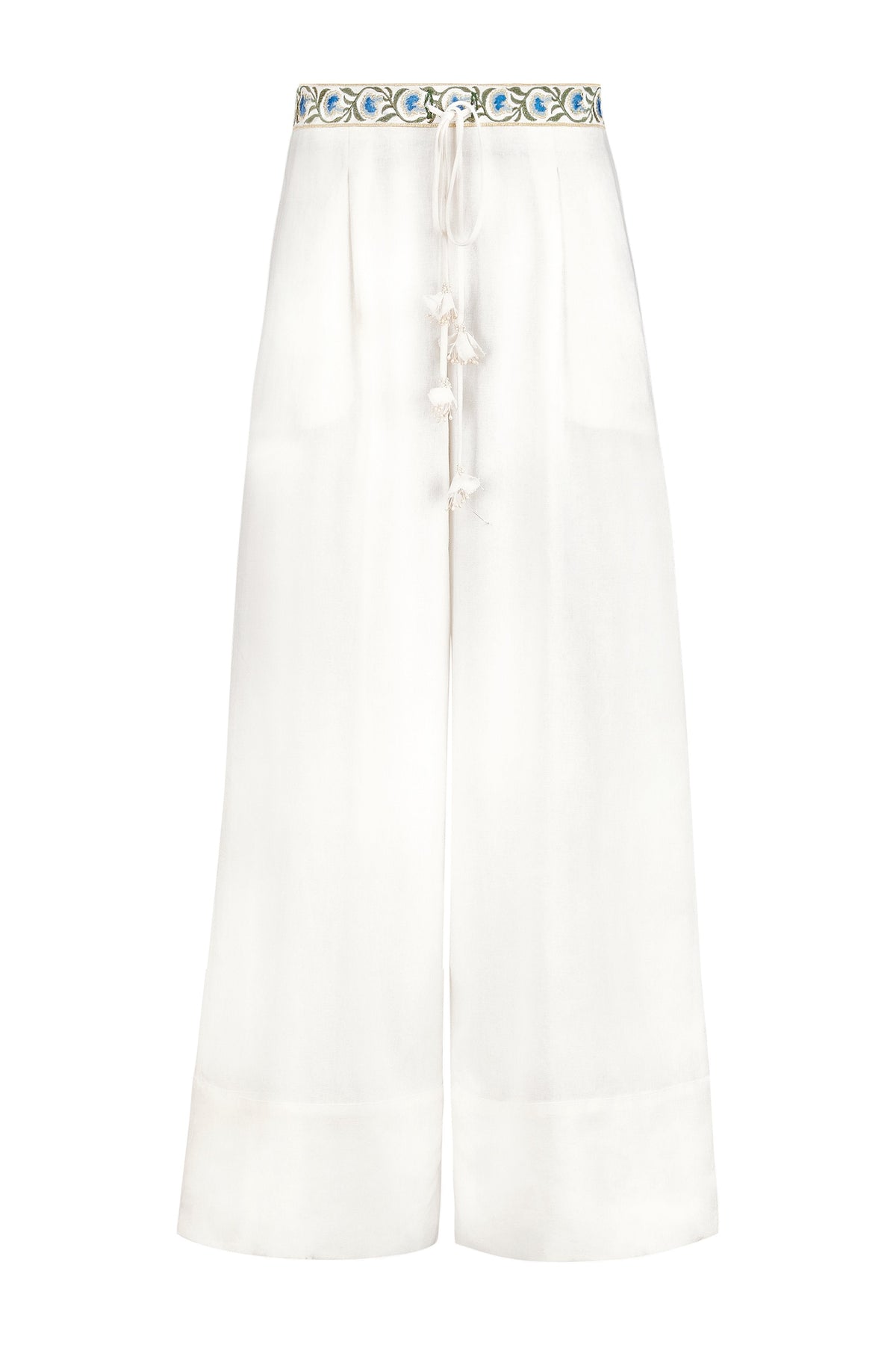 Front view of Carnation Pants showing embroidered blue floral waistband and tasseled drawstring on off-white wide-leg pants