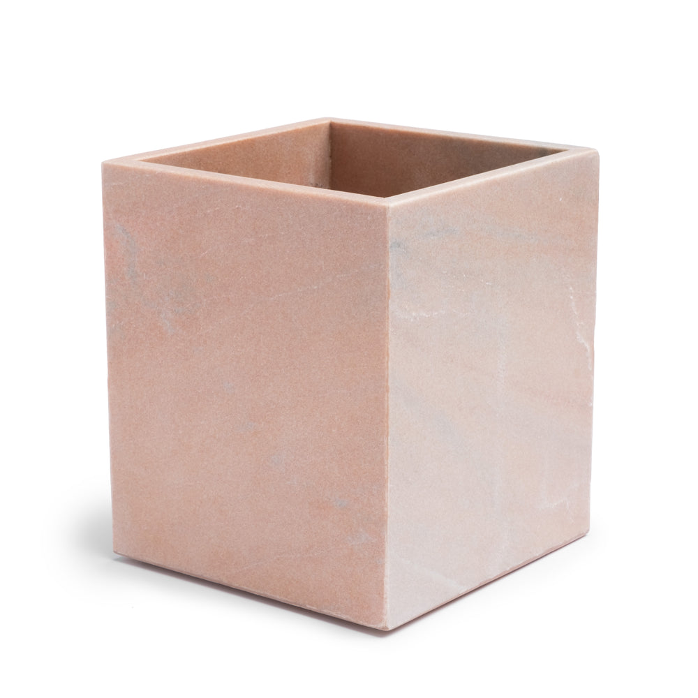 Three-quarter view of Rossa waste basket showcasing dusty rose veined marble on white background
