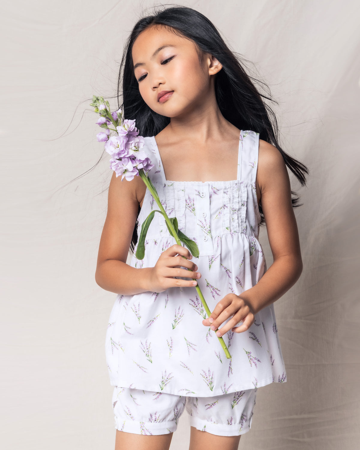 Front view of Children’s Fields of Provence Charlotte Short Set with lavender sprig print, buttoned top, and bloomer shorts