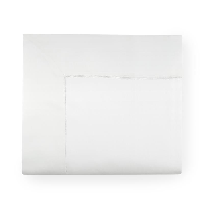 Top view of Giotto flat sheet in white showing hemstitch border on white background