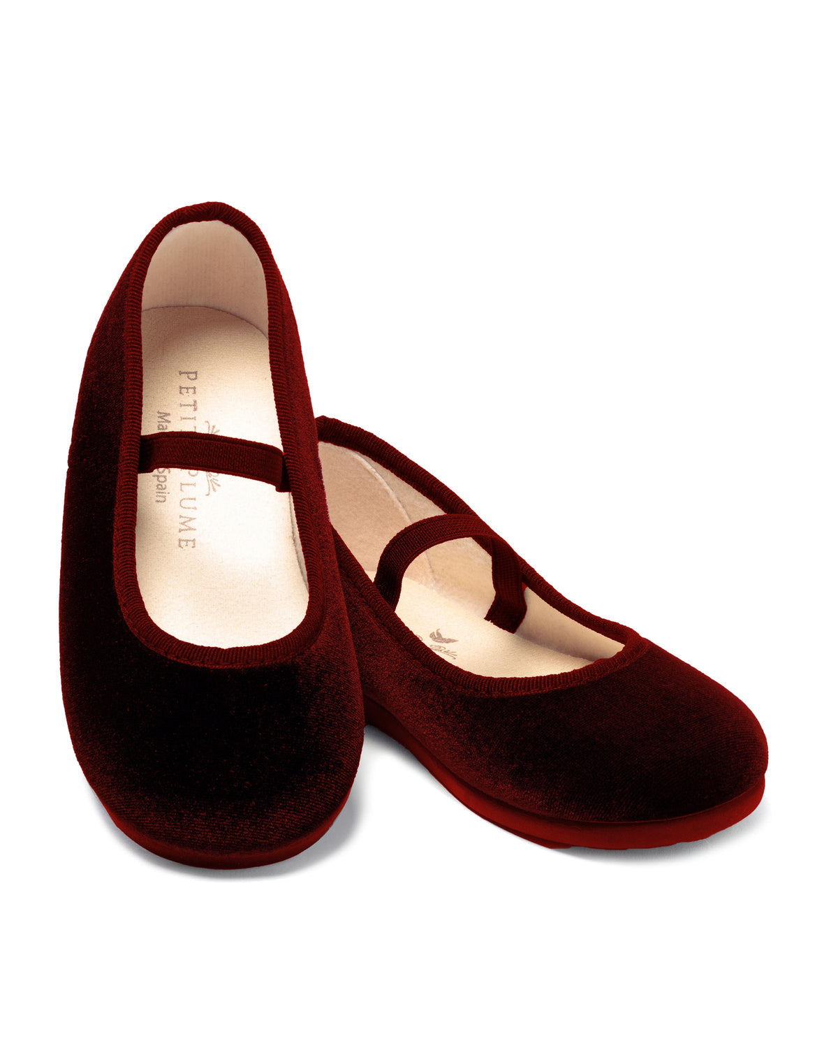 Close up of The Delphine Slipper in Bordeaux Velvet showcasing velvet uppers and soft insoles on a white background