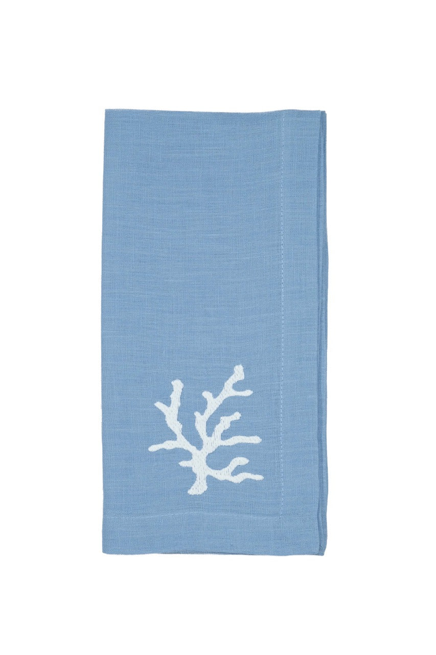 Front view of Mavi linen napkin showcasing white coral embroidery on white background