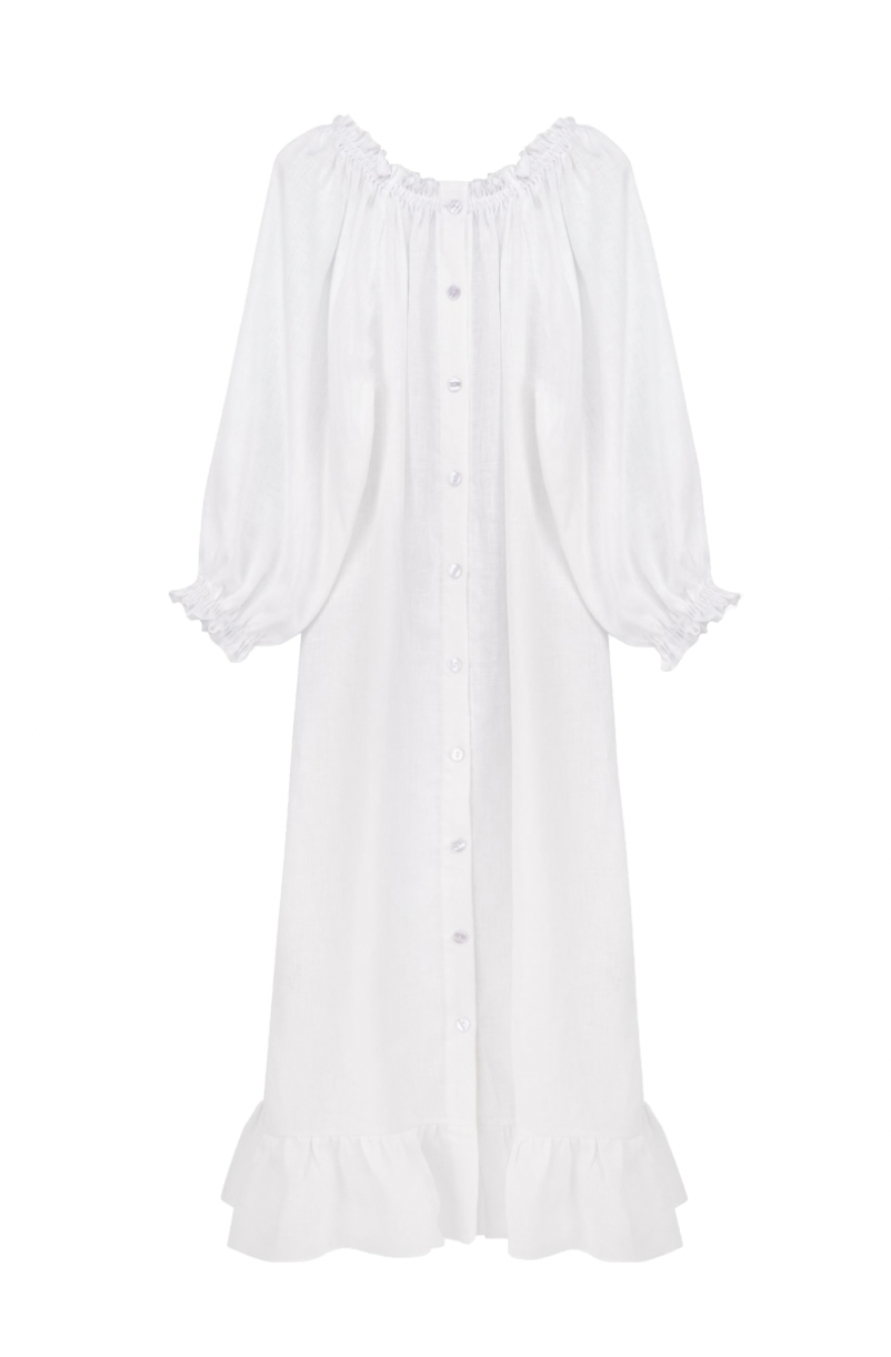 Front view of Sleeper Loungewear Dress in White showcasing long puff sleeves, front buttons, and ruffled hem on a white background