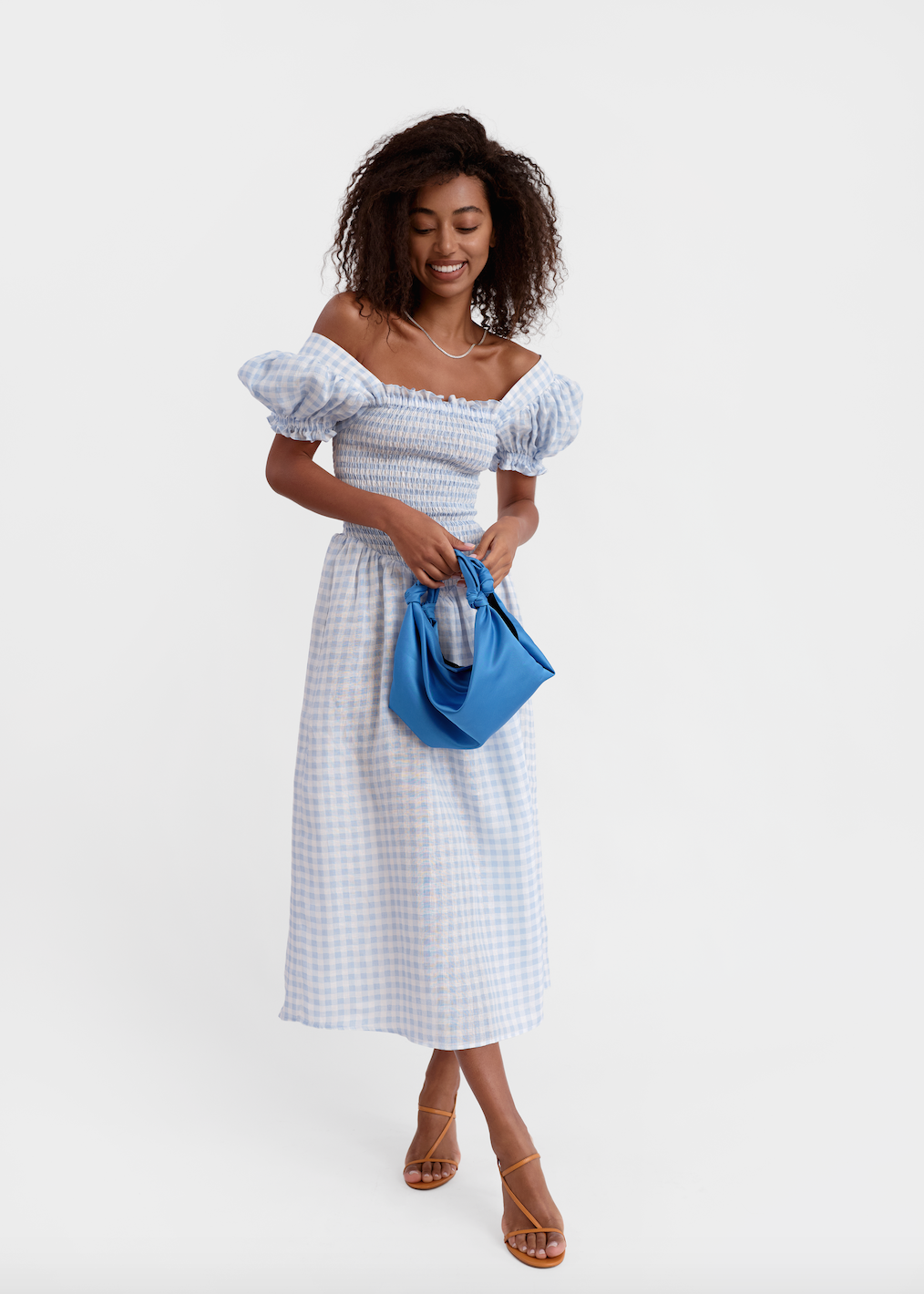 Front view of Belle Linen Dress in Blue Vichy showcasing off-shoulder neckline and lantern sleeves on a model