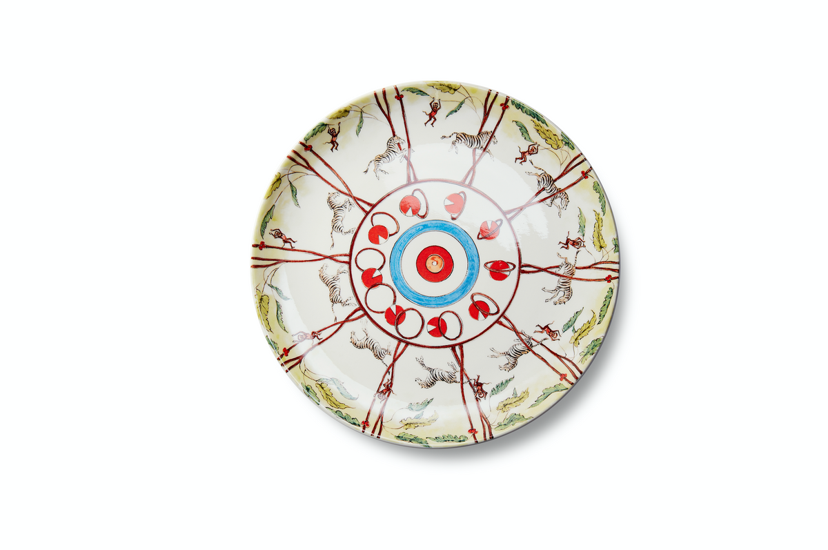 Top view of Zebra dessert plate by Playplates showing hand painted zebras, monkeys, and red and blue concentric center on white