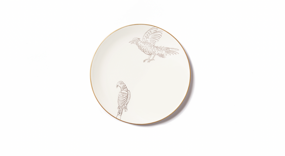 Top view of Calligraphario dessert plate showcasing two brown calligraphic bird illustrations and gold rim on white background