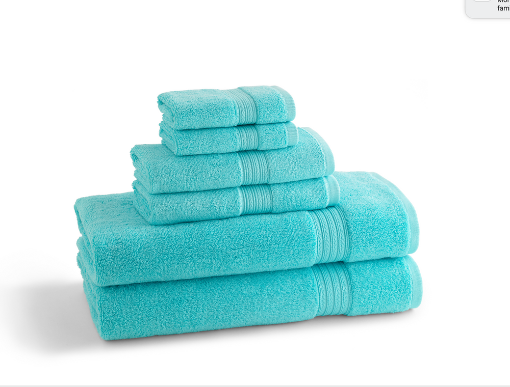 Stacked turquoise towel set showing plush terry texture and ribbed border on white background