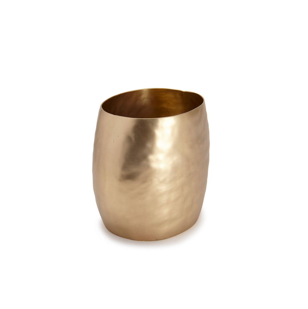 Front view of Nile Bath toothbrush holder showcasing hammered brass finish and irregular oval shape on white background