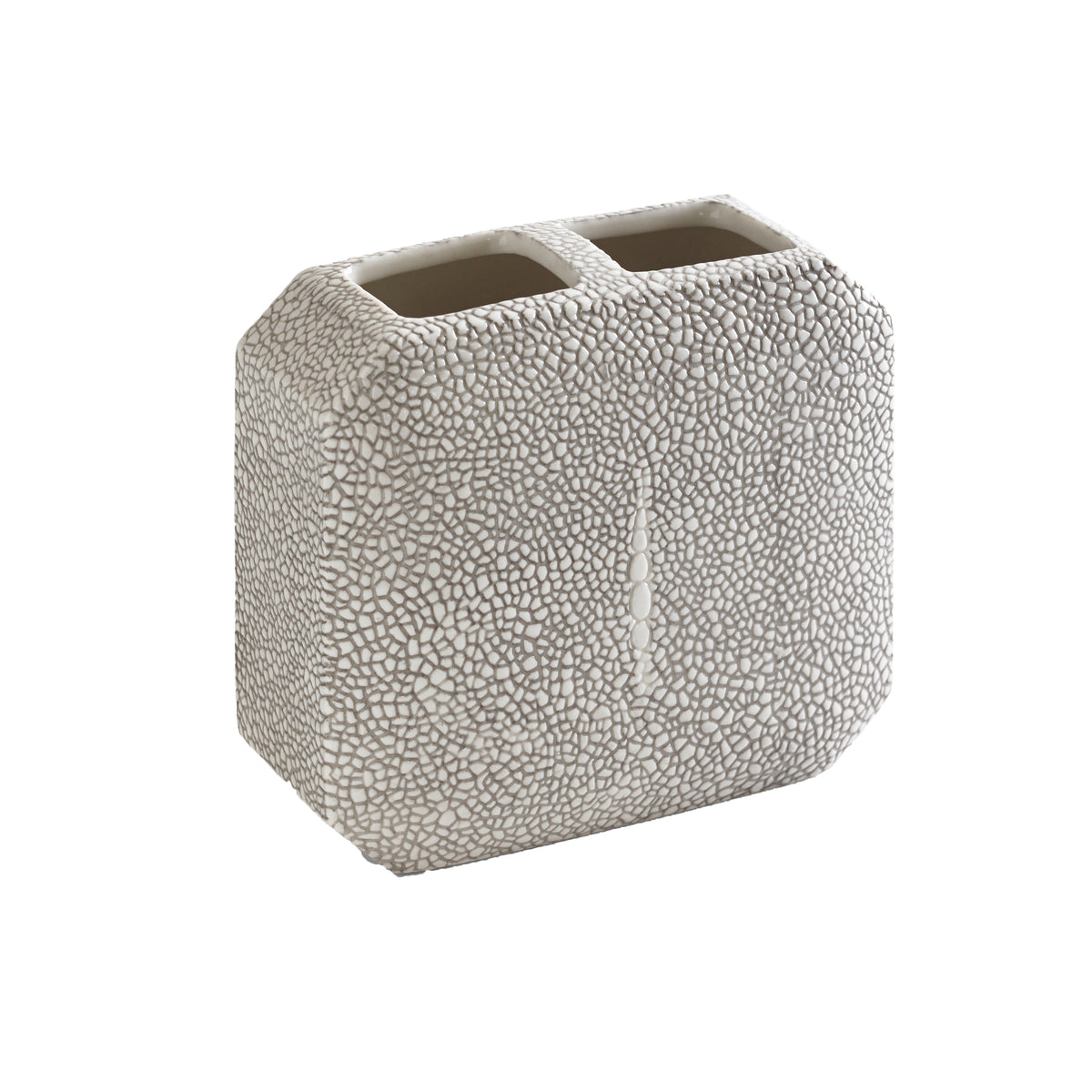 Three-quarter view of Shagreen toothbrush holder in gray showcasing embossed shagreen porcelain texture on white background