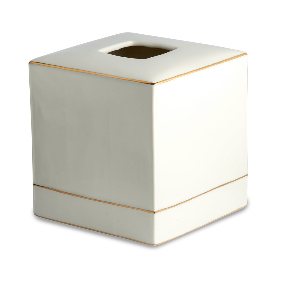 Three-quarter view of St. Honore tissue holder showcasing white porcelain cube with gold trim on white background
