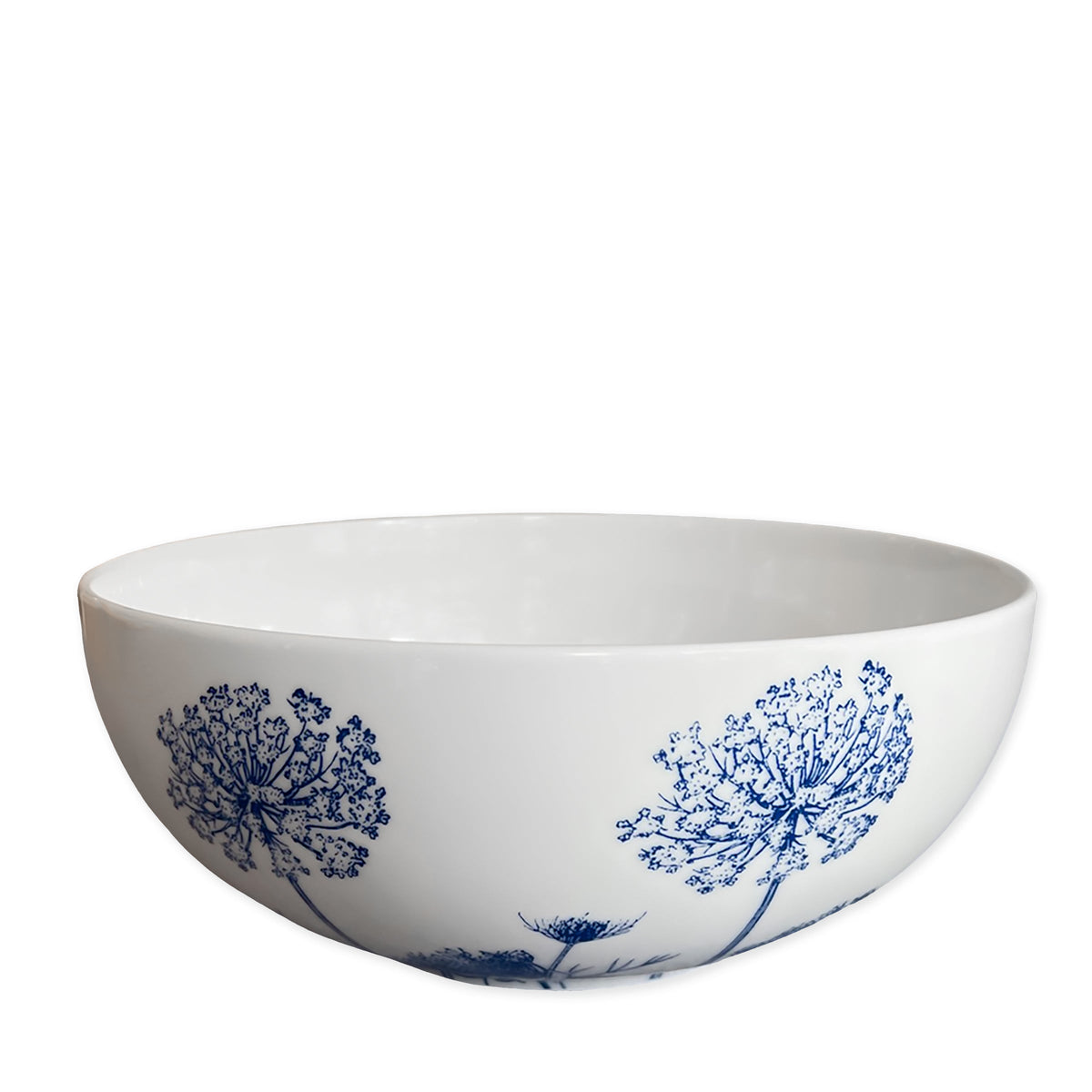 Front three-quarter view of Summer Blues Vegetable Serving Bowl showcasing blue floral porcelain design with white background