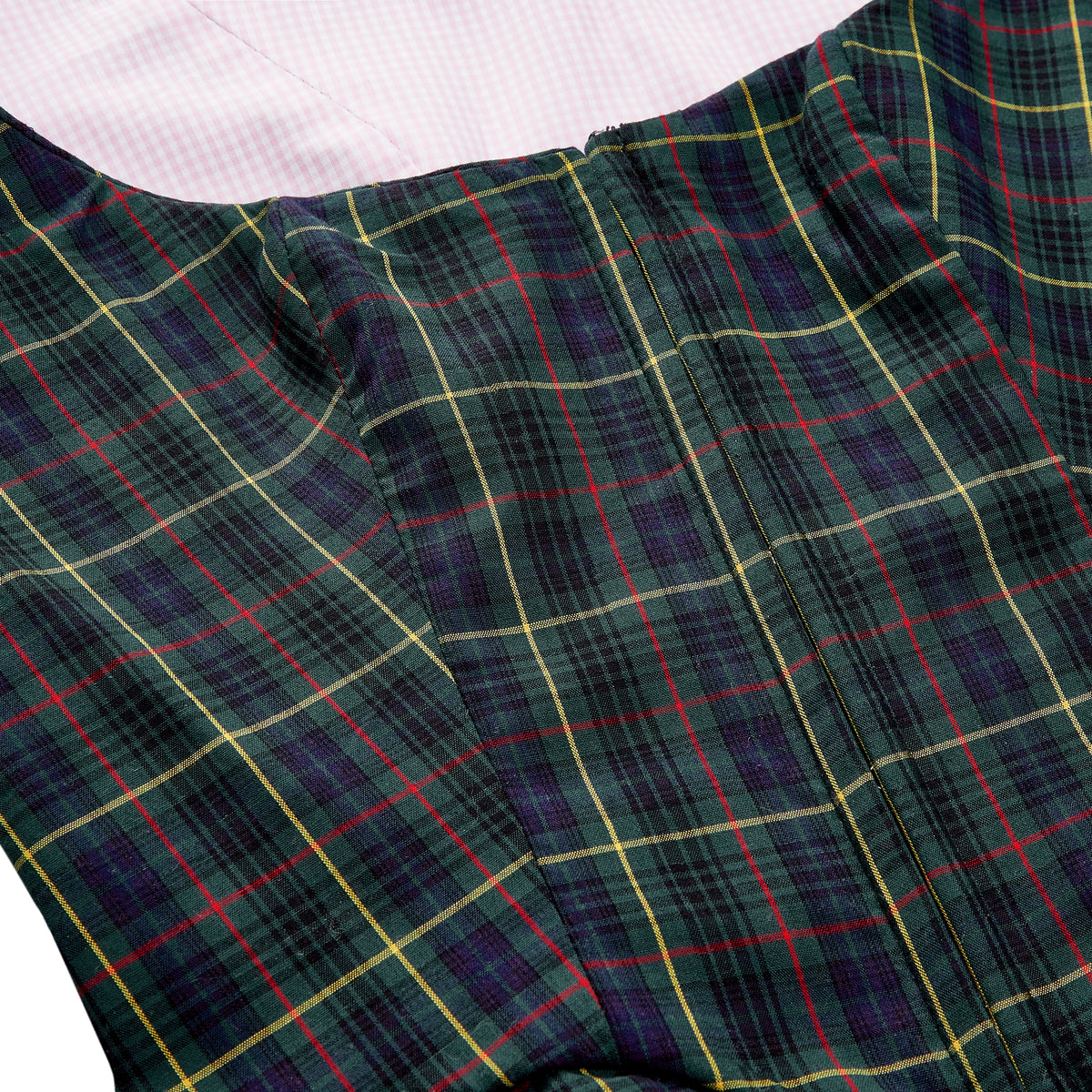 Close-up of Roya Bodice in tartan showcasing center back zipper and pink gingham lining