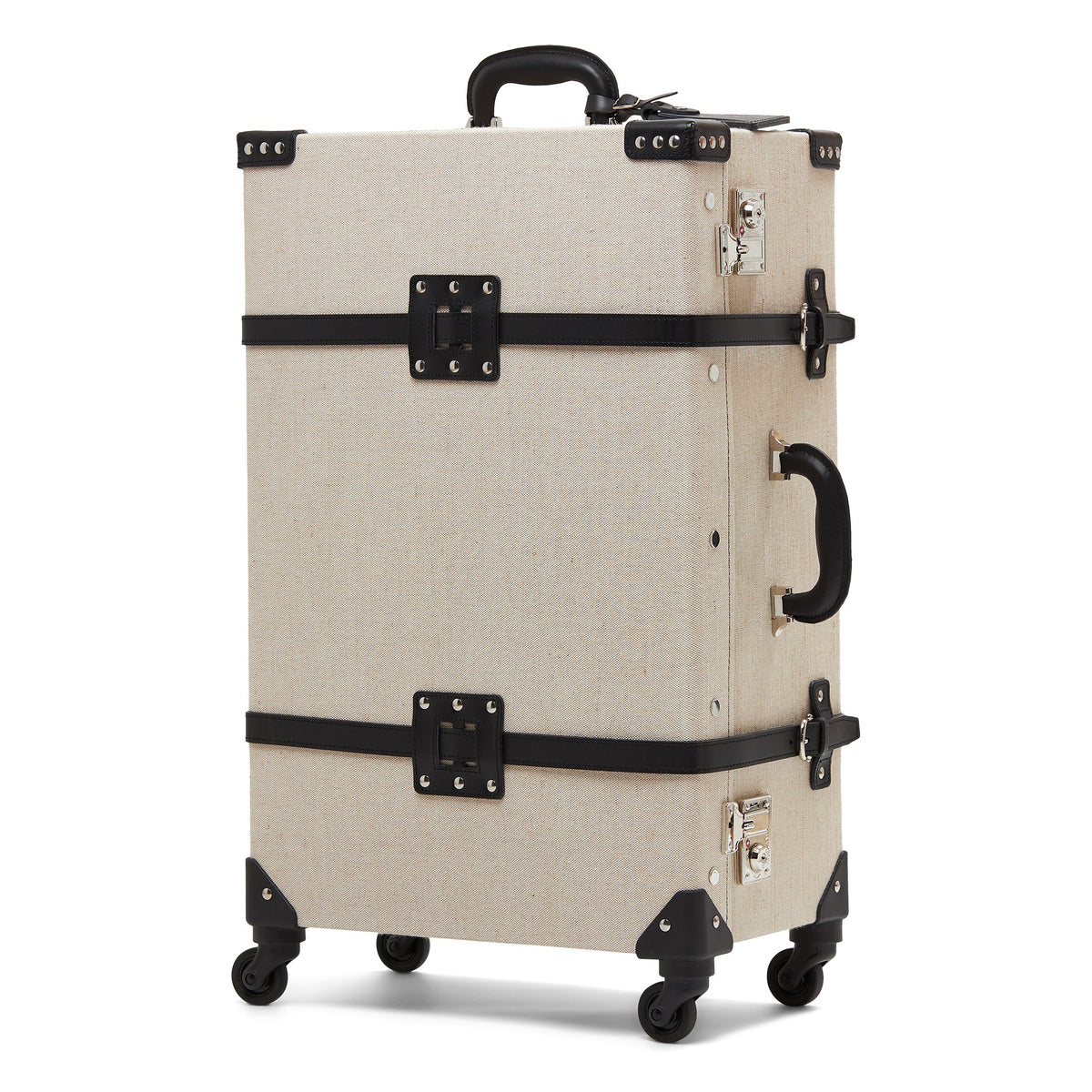 Angled front view of The Editor Check In Spinner showcasing black leather straps, silver locks, and four wheels on white