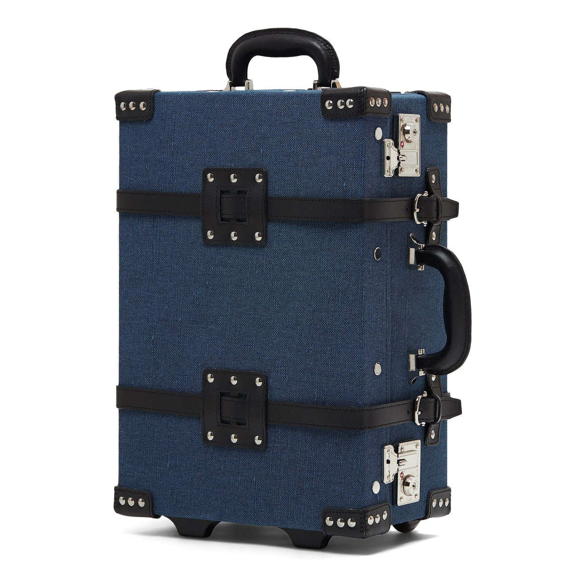 Three-quarter view of The Editor in Navy Carryon showcasing navy linen and black leather straps on a white background