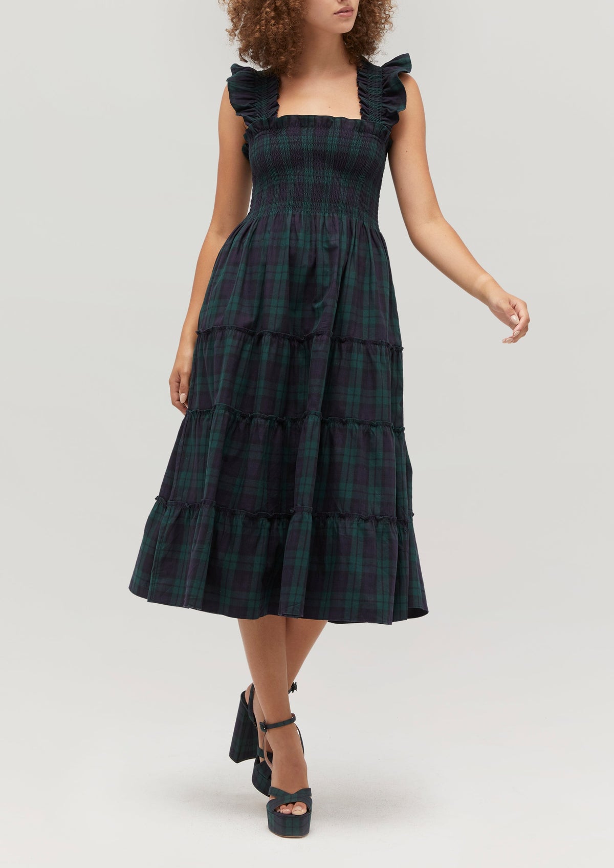Gabriella is 5' 9.5" and wears a size XS in the Blackwatch Tartan color: Blackwatch Tartan
