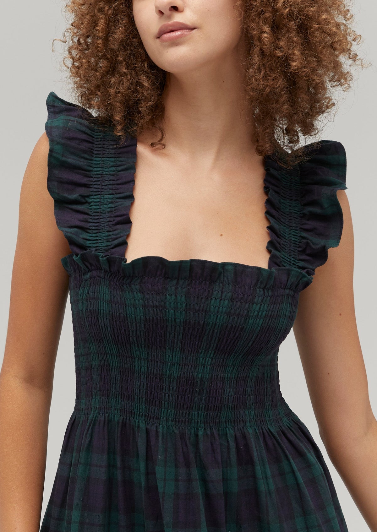 Gabriella is 5' 9.5" and wears a size XS in the Blackwatch Tartan color: Blackwatch Tartan
