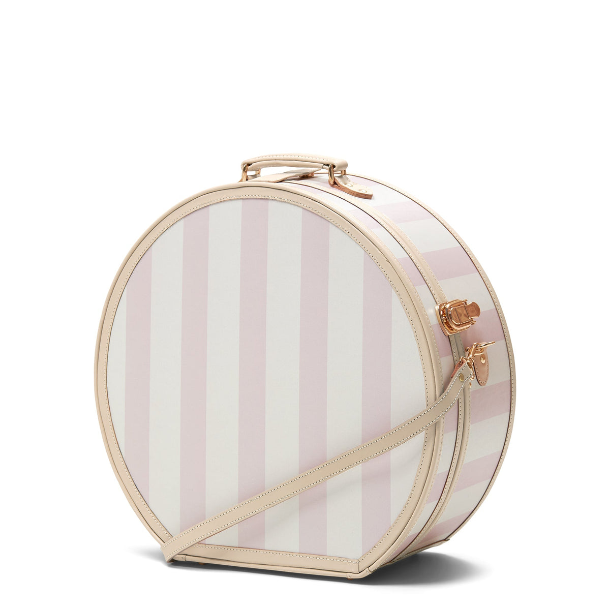 Three-quarter view of The Illustrator Deluxe pink hatbox showing vertical pink-and-white stripes, tan leather trim, top handle, and gold hardware on white background