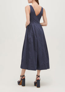Ava is 5’9” and wears a size XS in the Navy Polka Dot Cotton Sateen color: Navy Polka Dot Cotton Sateen