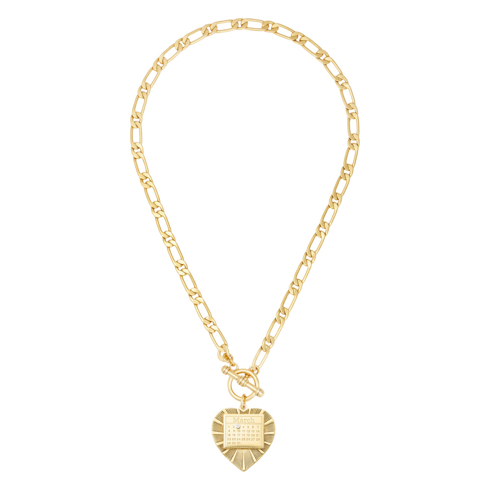 Front view of The Best Day Necklace Figaro chain in gold showcasing a heart pendant engraved with a March calendar and a front toggle clasp on white background