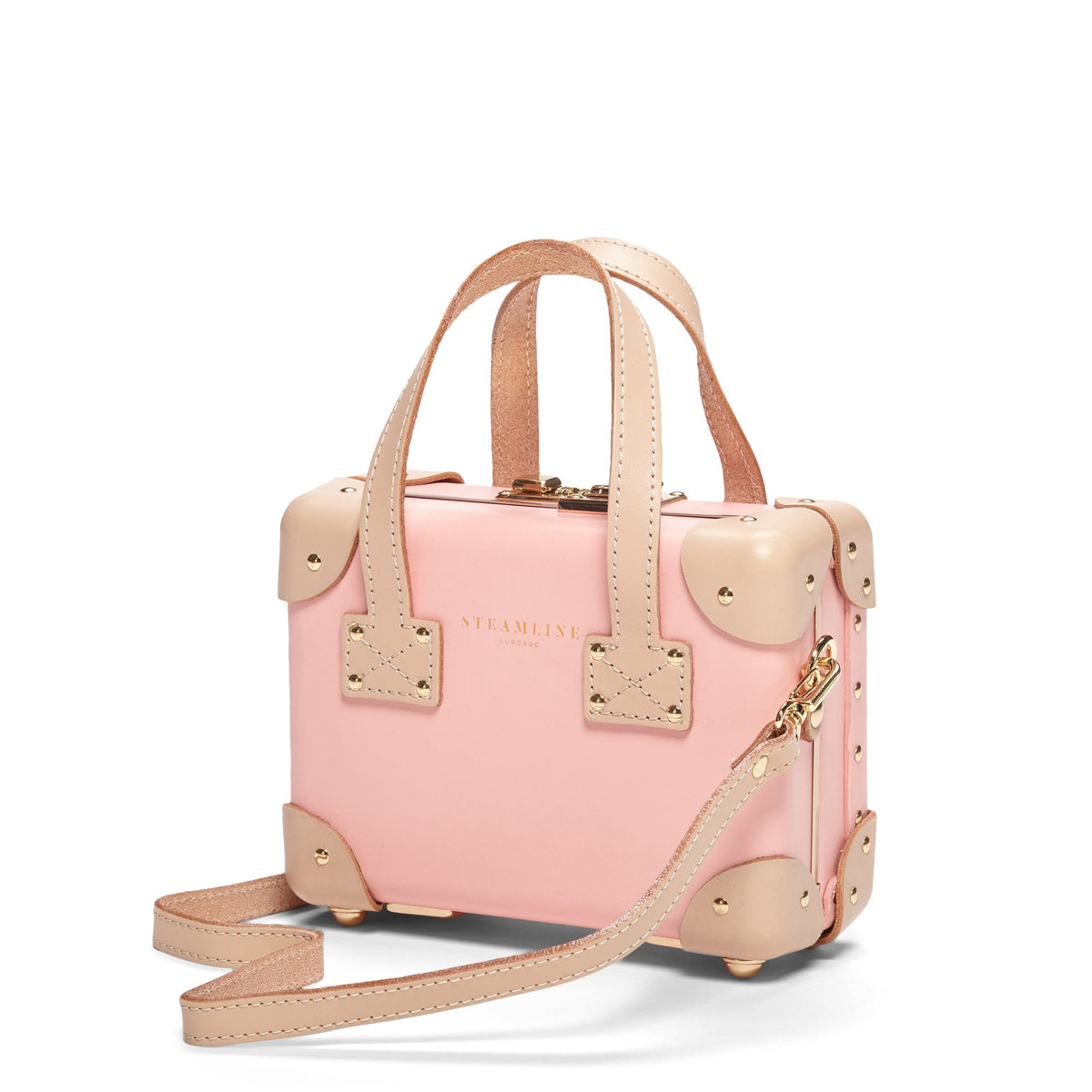 Front view of The Correspondent Pink Mini showcasing gold hardware and tan leather straps with a white background