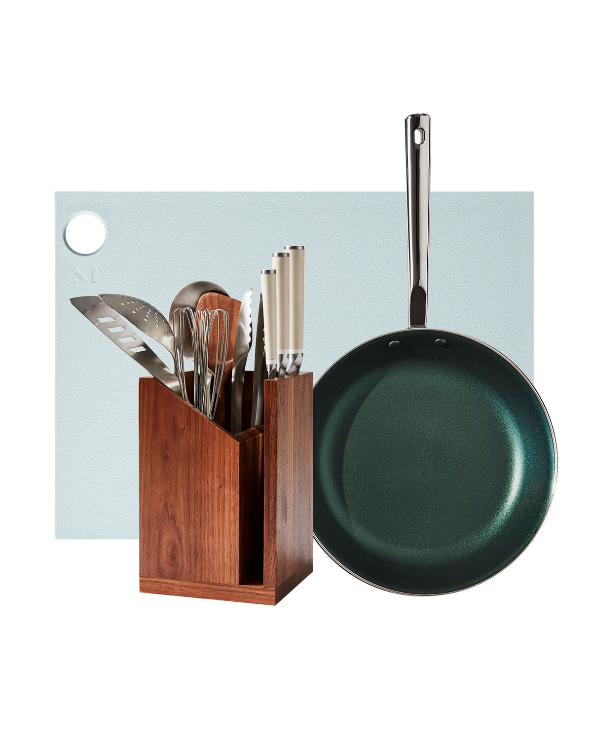 Front view of The Kitchen Starter Set showcasing knives, utensils, wooden block, and coated pan on a light blue background