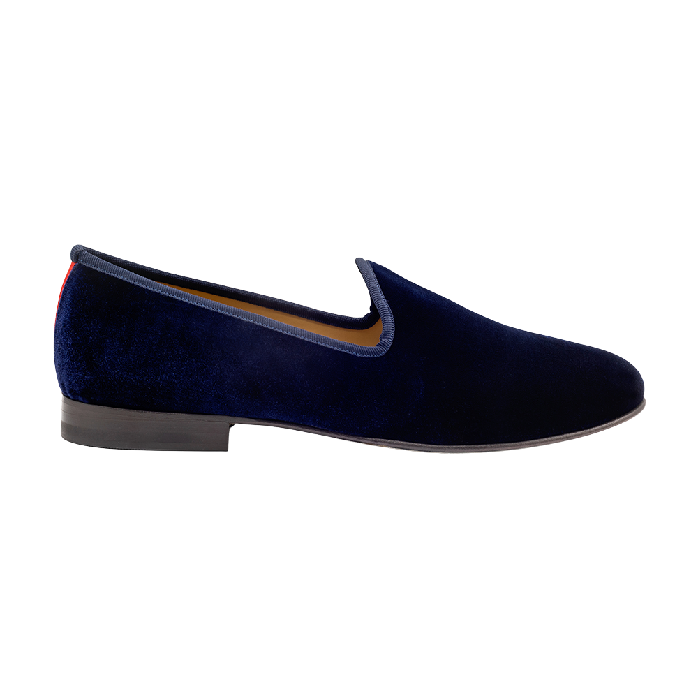 Side view of Men’s Navy Velvet Slipper II showcasing navy velvet exterior, low heel, and leather sole on a white background
