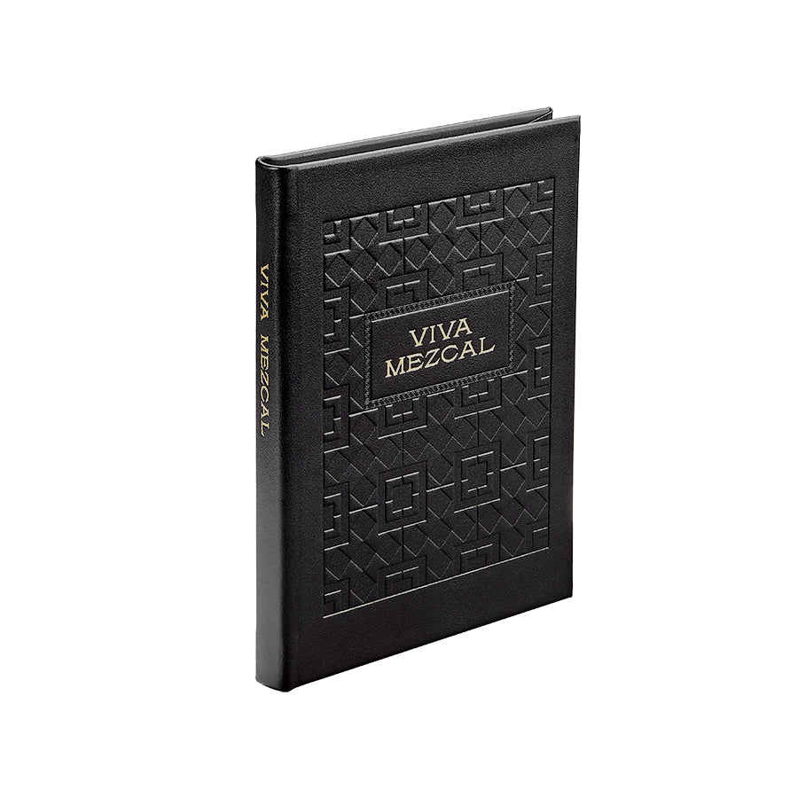 Front three-quarter view of the Viva Mezcal in Bonded Leather notebook showcasing its embossed geometric cover and gold title on a white background