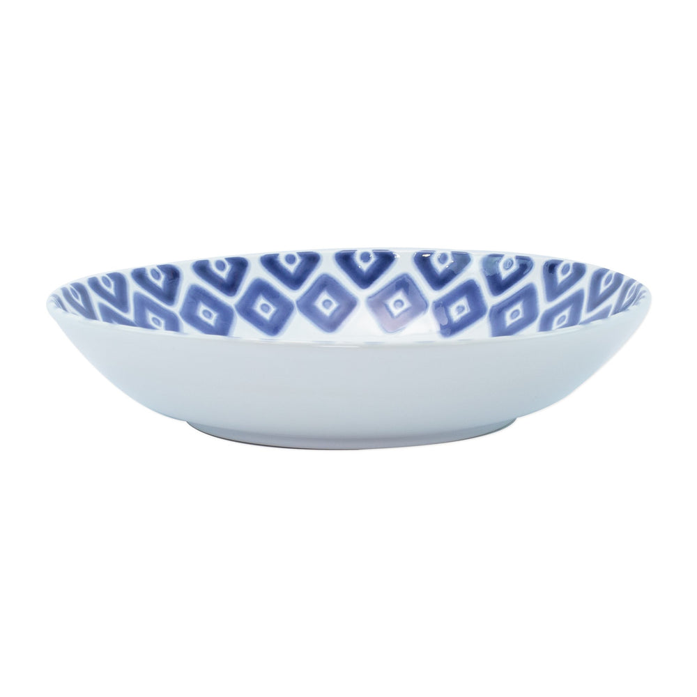 Side view of Santorini Diamond medium ceramic serving bowl showcasing blue diamond patterned interior on white background