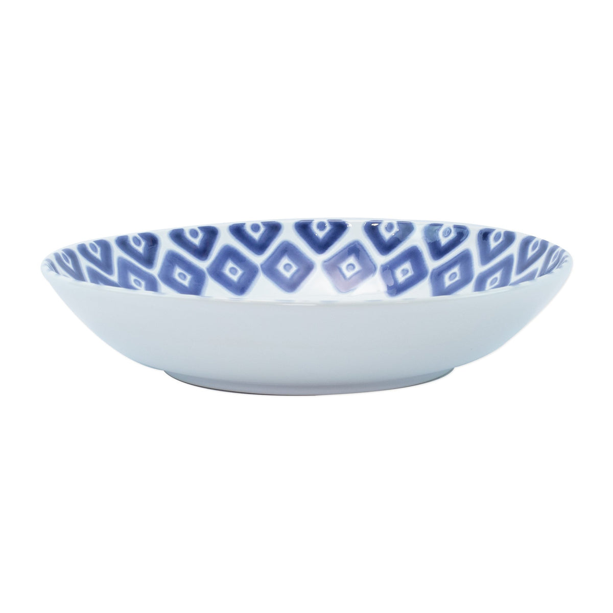 Side view of Santorini Diamond medium ceramic serving bowl showcasing blue diamond patterned interior on white background
