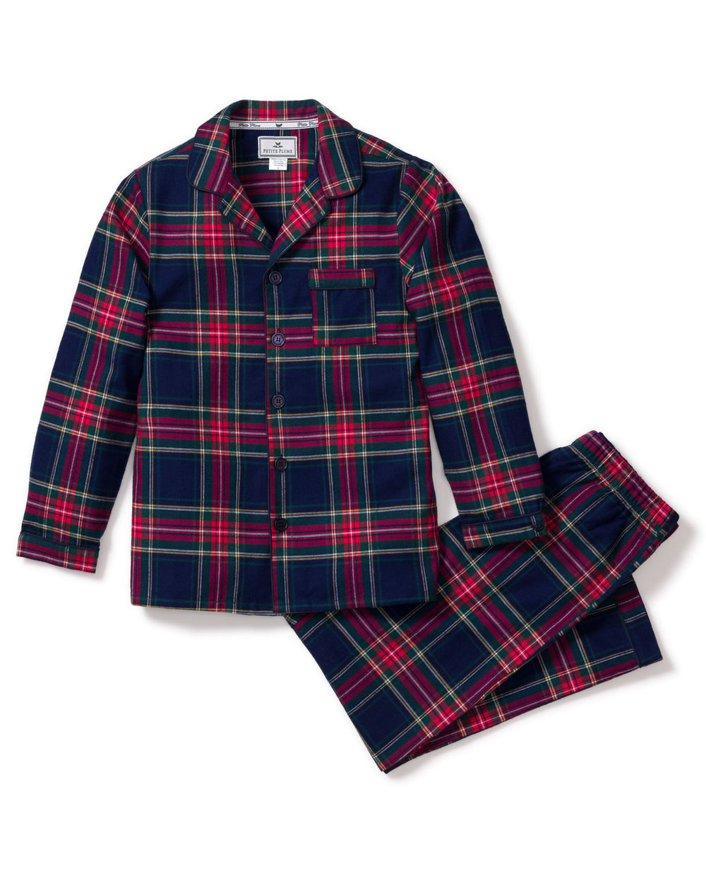 Flat lay of children’s Windsor tartan pajama set: navy-red plaid button-front top with pocket and pants on white