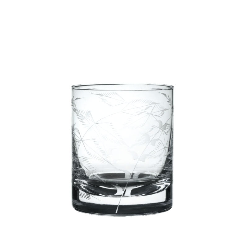 Front view of crystal whiskey glass showcasing etched fern engraving on clear glass with white background