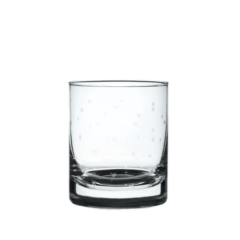 Front view of a crystal whiskey glass showcasing hand-engraved stars against a white background