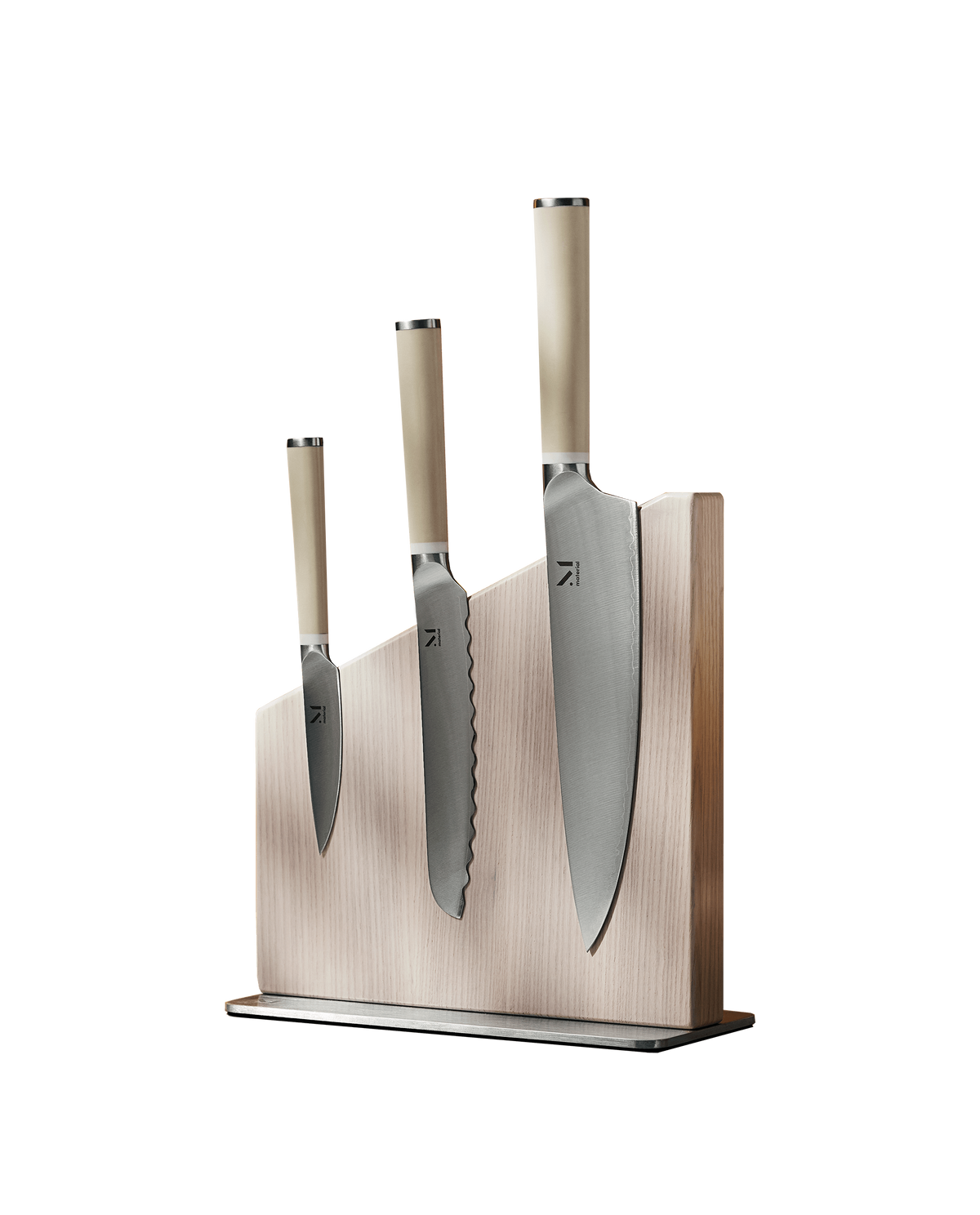 Front view of The Knives + Stand showcasing three knives on a magnetic wooden stand with white background