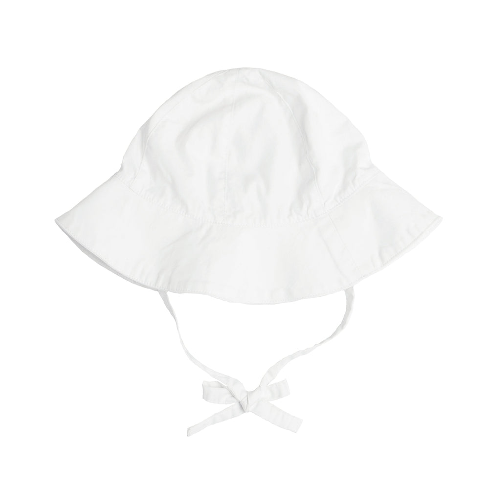 Flat lay of white sun hat showcasing wide brim and tie straps on white background