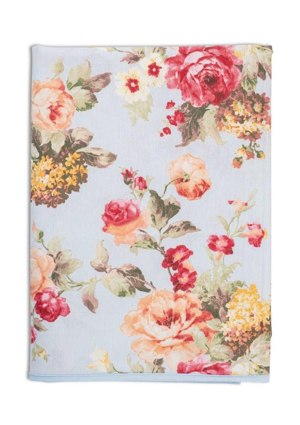 Folded Wild Roses tablecloth showing large pink and peach floral print on a light blue background