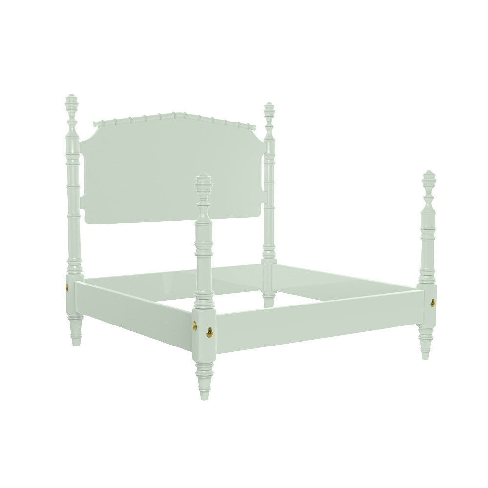 Three-quarter view of Wilton bed frame showcasing turned bamboo-style posts, decorative finials, and scalloped headboard on white background