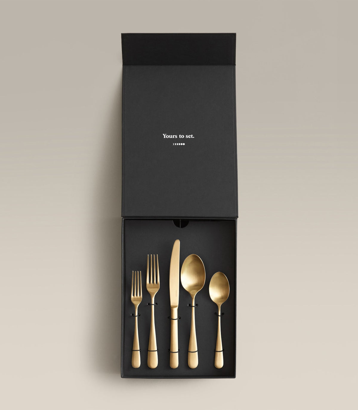 flatware set in brushed gold & black