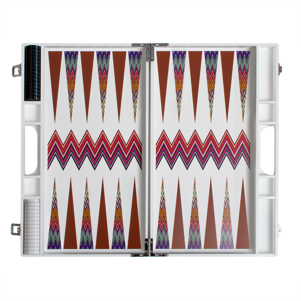 Top view of Zig Zag backgammon board showcasing white surface with multicolor zigzag stripe and brown points, chip storage