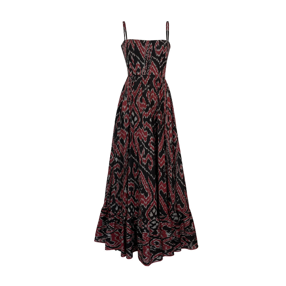 Front view of Aries Dress with cinched waist, corset bodice, shoulder straps, and black, red, and grey ikat pattern on white background