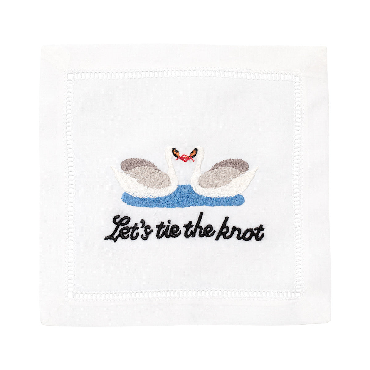Front view of Let’s Tie The Knot cocktail napkin showcasing embroidered swans and lettering on white linen fabric