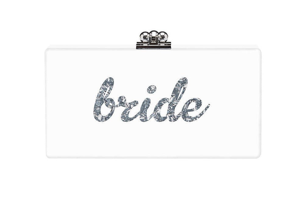 Front view of Custom Slim Jean Clutch showcasing silver confetti script reading bride and a silver kiss-lock clasp on white background