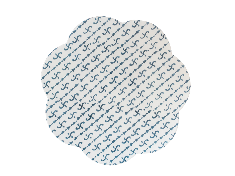 Top view of Brooks Block Print placemat with scalloped edges and blue diagonal block-print pattern on white background