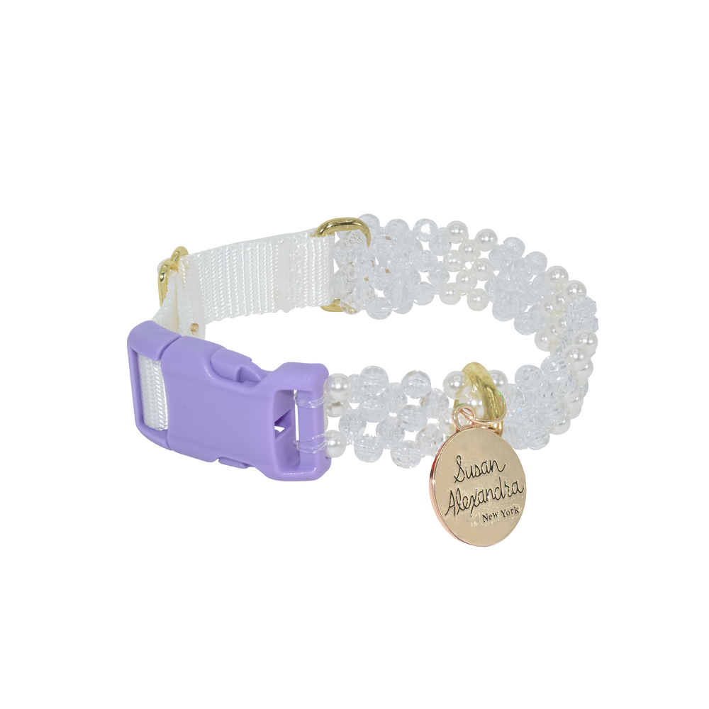 Angled view of I Do! dog collar with lavender buckle, crystal and pearl beading, and gold Susan Alexandra tag on white