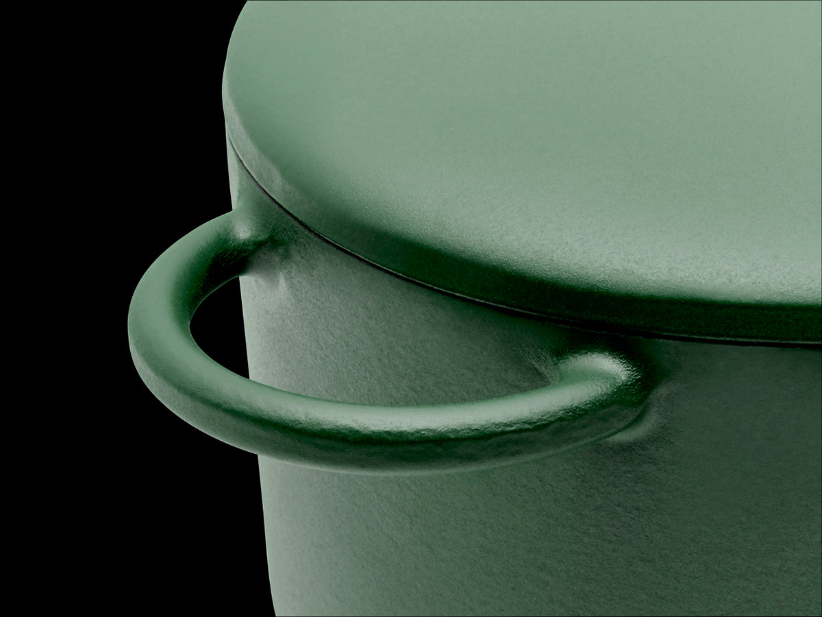 Enameled cast-iron Dutch oven in broccoli green - handle close-up
