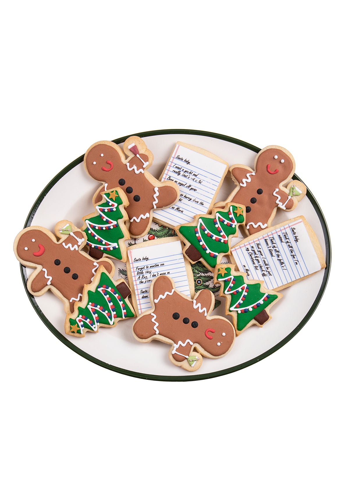 Top-down view of Santa Baby sugar cookies (set of 12) showing frosted gingerbread people, decorated Christmas tree cookies, and note-shaped cookies on a white plate