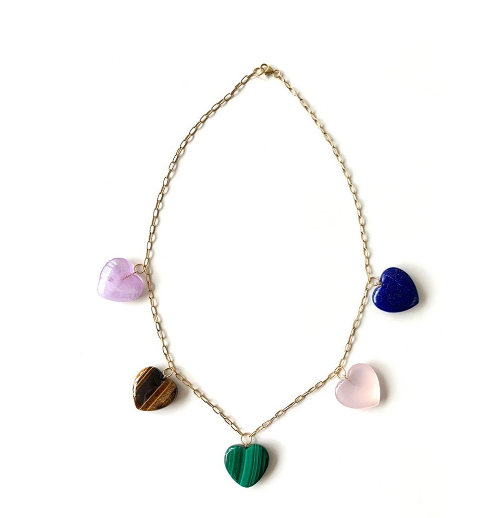 Front view of Multi Gem Heart Necklace showcasing five hand-carved gemstone hearts on an 18K yellow gold chain with white background