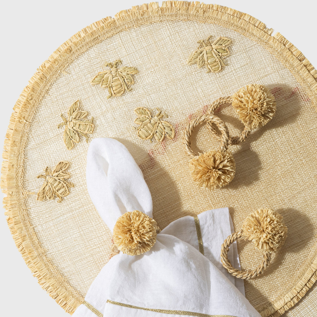 Straw Pompom Napkin Rings in Natural, Set of Four